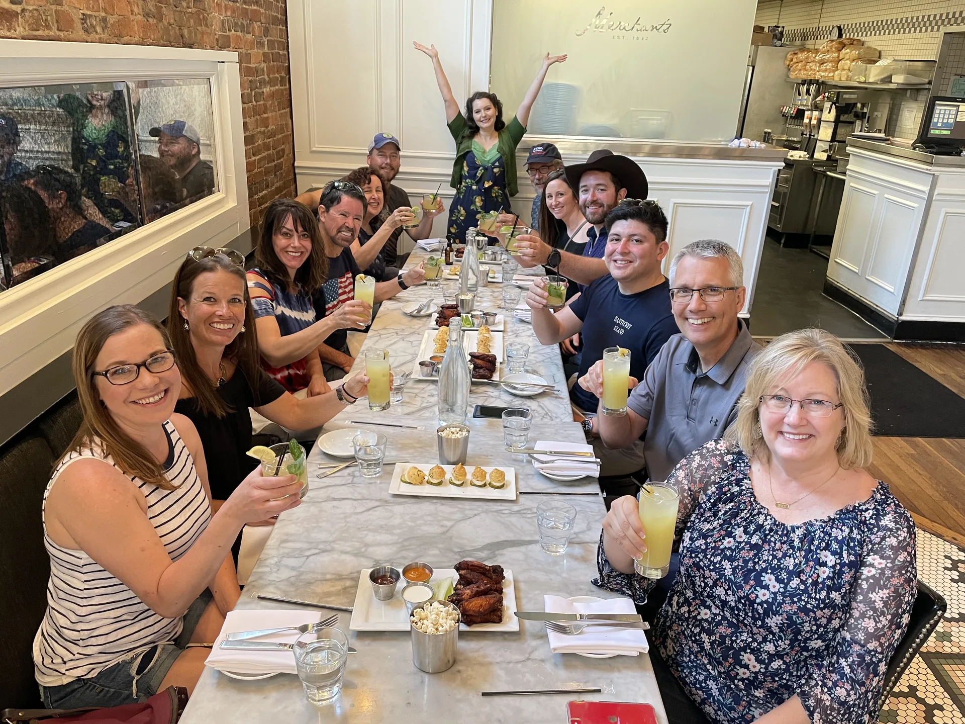 A food tour group together at Merchants restaurant in downtown Nashville